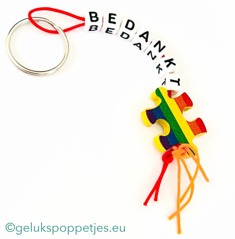 Sleutelhanger bedankt met gelukspoppetje puzzelstukje