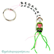 Sleutelhanger bedankt met gelukspoppetje dochter