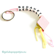 Sleutelhanger bedankt met gelukspoppetje spekje