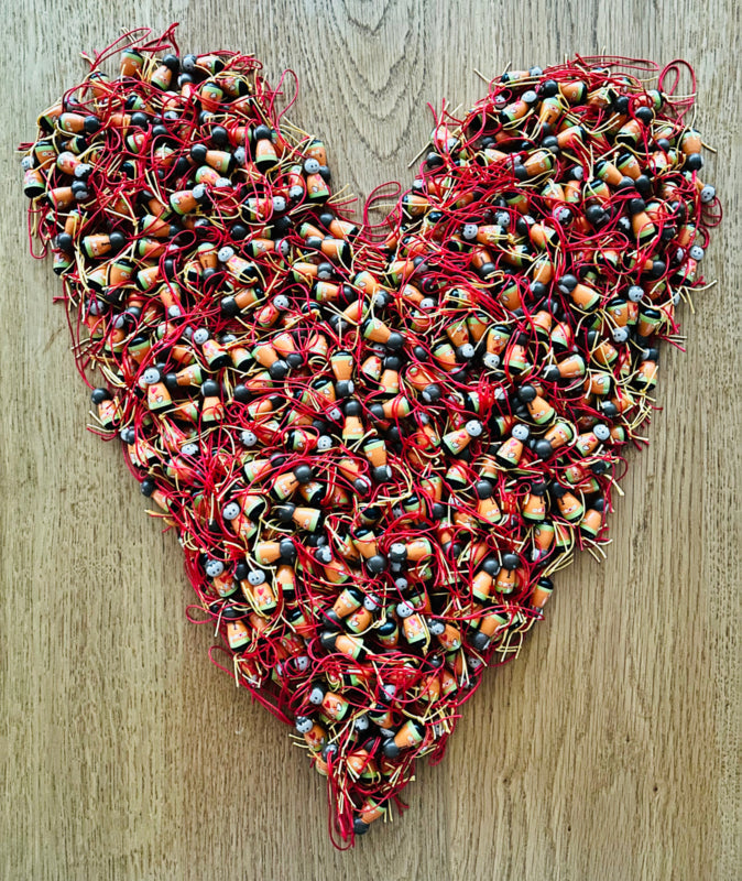 Gelukspoppetje met vlechtje