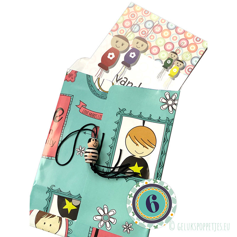 Gelukspoppetjes inpakpapier familie