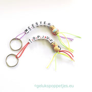 Sleutelhanger meester met houten gelukspoppetje