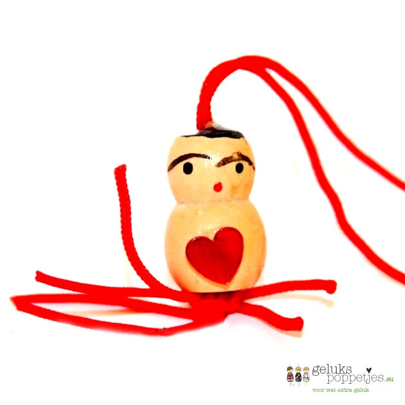 Gelukspoppetje met hartje op de buik