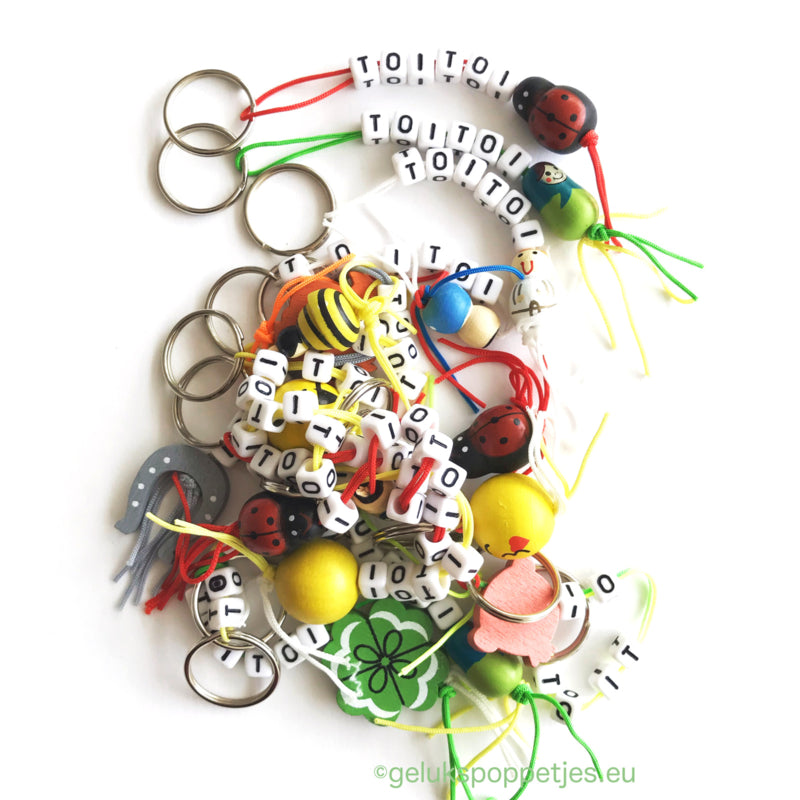 Sleutelhanger bedankt met verschillende gelukspoppetjes