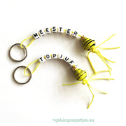 Sleutelhanger meester met gelukspoppetje bijtje