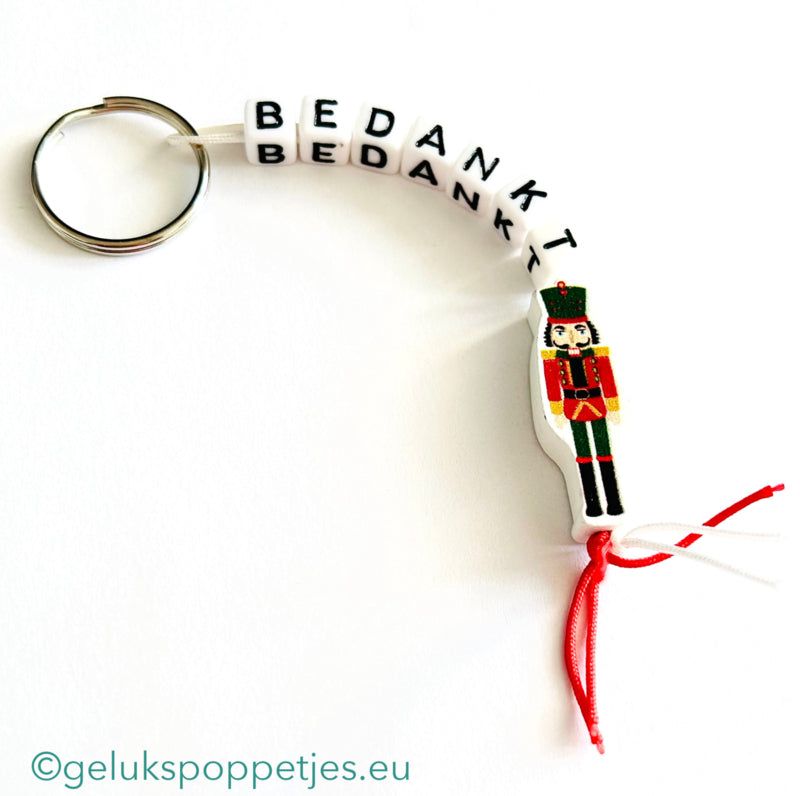 Sleutelhanger bedankt met gelukspoppetje notenkraker