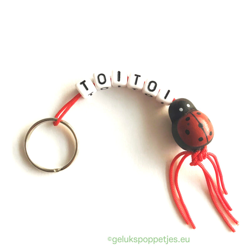 Sleutelhanger toitoi met gelukspoppetje klavertje vier