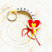 Keychain "love" with hugging lucky doll