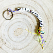 Sleutelhanger Miss Social met gewoon gelukspoppetje